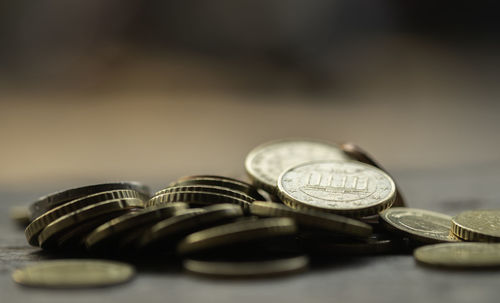 Close-up of coins on table