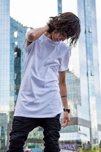 Midsection of man standing against the sky