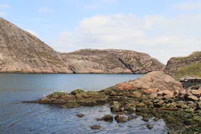Scenic view of sea against cloudy sky