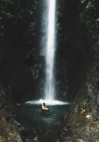 Scenic view of waterfall in forest