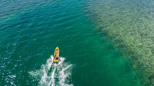 High angle view of man surfing in sea