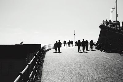 People walking on bridge