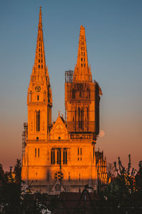 Low angle view of building against sky during sunset