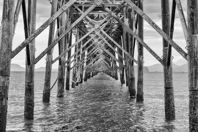 Pier over sea against sky