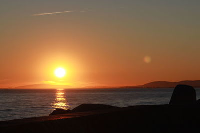 Scenic view of sea at sunset