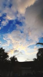 Low angle view of silhouette buildings against sky during sunset