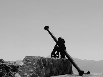 Silhouette of woman against clear sky