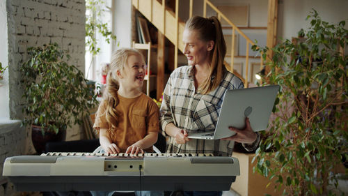 Young woman using laptop at home