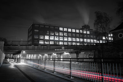 Low angle view of illuminated train at night