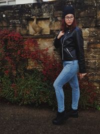 Portrait of smiling young woman standing outdoors