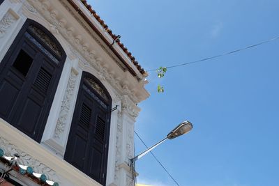 Low angle view of building against blue sky