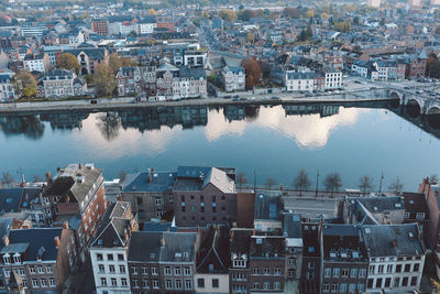 High angle view of river amidst houses in town