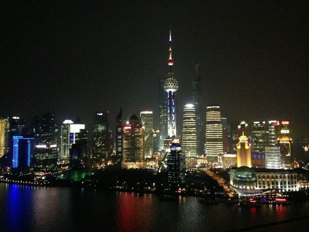 illuminated, night, city, building exterior, architecture, built structure, skyscraper, tower, cityscape, tall - high, capital cities, modern, travel destinations, office building, famous place, travel, international landmark, urban skyline, water, tourism