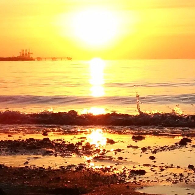 sunset, water, sun, orange color, silhouette, sea, scenics, beauty in nature, sky, reflection, tranquil scene, beach, tranquility, nature, sunlight, idyllic, shore, lifestyles