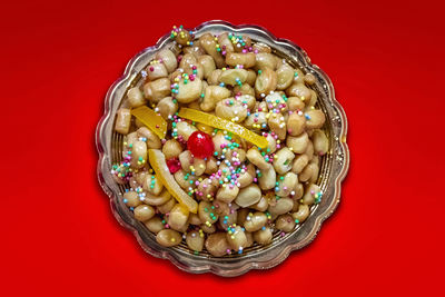 Directly above shot of food in bowl on yellow background