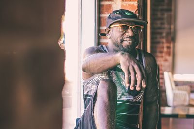 Portrait of man wearing sunglasses standing outdoors