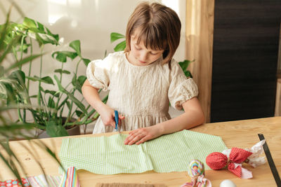 Boy drawing on table