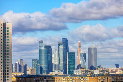 Modern buildings in city against sky