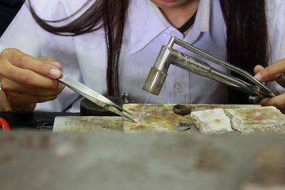 Close-up of man preparing food