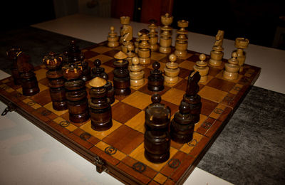 High angle view of chess pieces on table