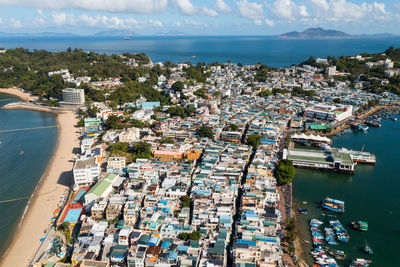 High angle view of harbor and buildings in city