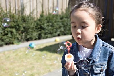 Boy holding bubbles