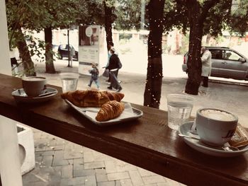 View of breakfast and coffee served on table