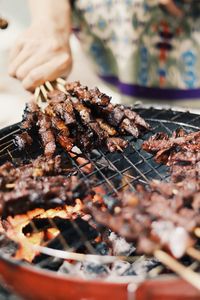 Midsection of man preparing food