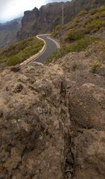 Scenic view of mountain road against sky