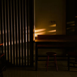 Empty chairs and table in building