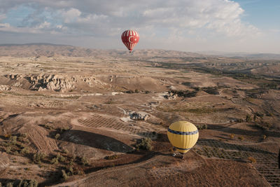 Hot air balloon flying over land