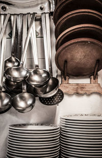 Close-up of kitchen equipment hanging on wall