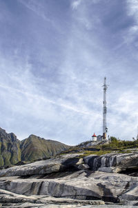 Electricity pylon on landscape against sky