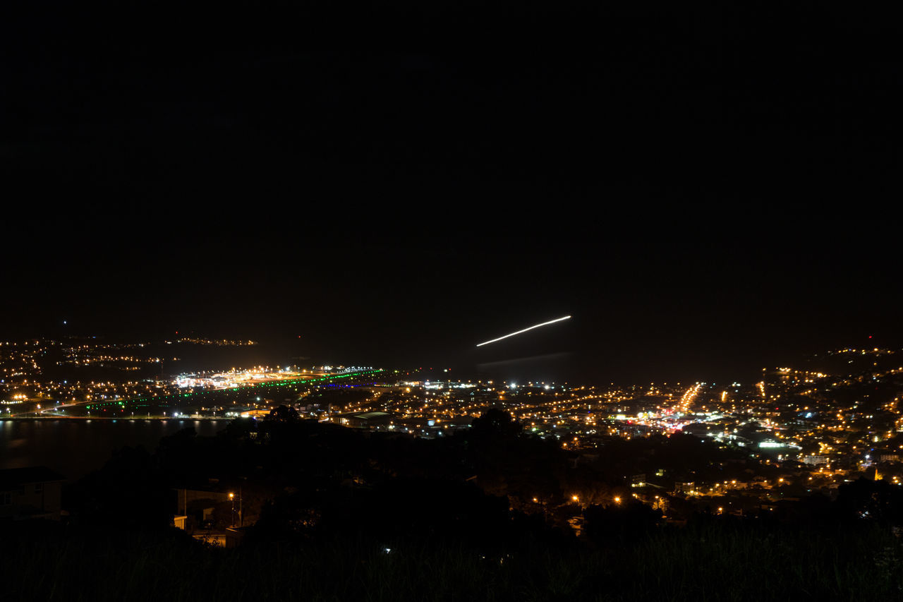 ILLUMINATED CITYSCAPE AT NIGHT