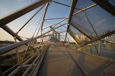 View of bridge against cloudy sky during sunset