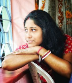 Portrait of young woman looking away