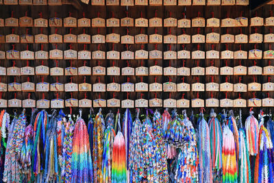 Full frame shot of colorful souvenirs hanging for sale in market