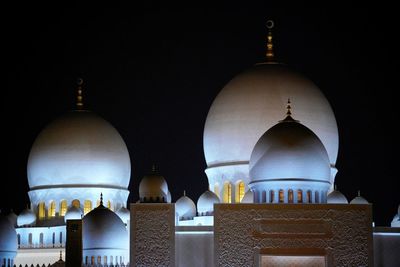 Night view on illuminated marble domes of grand mosque