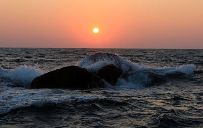 Scenic view of sea against sky during sunset