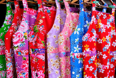 Colorful clothes hanging for sale in market