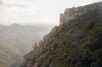 Scenic view of cliff against sky