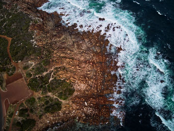 High angle view of rocks in sea