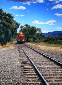 Train on railroad track against sky