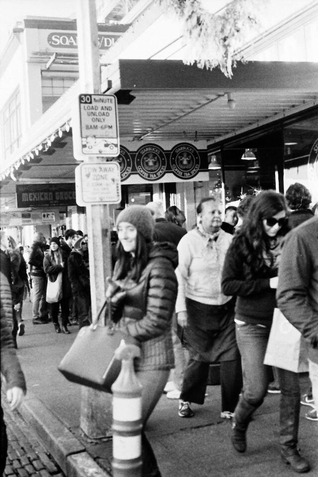 lifestyles, large group of people, leisure activity, casual clothing, men, street, person, full length, togetherness, city, city life, standing, architecture, built structure, walking, building exterior, childhood, boys, happiness