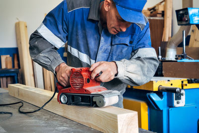 Midsection of man working at home