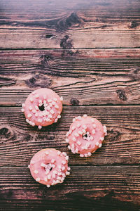 High angle view of pink flower on table