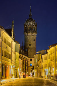 Illuminated buildings in city at night