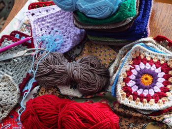 Close-up of knitting equipment on table