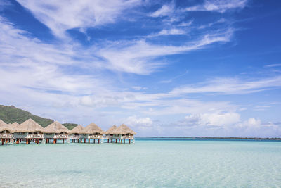 Scenic view of sea and buildings against sky