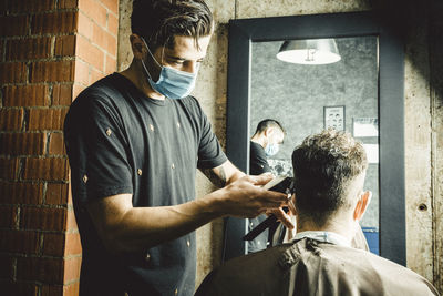 Beautician and hairdresser working with mask for the covid19 virus